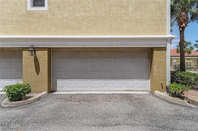 garage featuring driveway