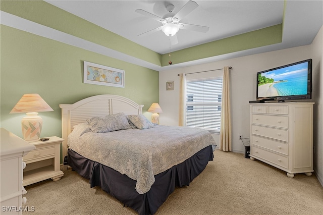 bedroom with light carpet and ceiling fan