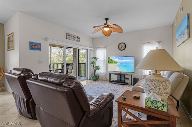 living room featuring light tile patterned flooring and ceiling fan