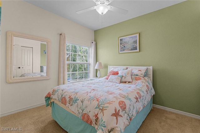 bedroom featuring carpet, baseboards, and a ceiling fan