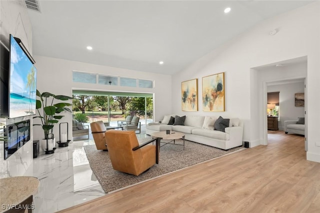 living room with high vaulted ceiling, visible vents, wood finished floors, and recessed lighting