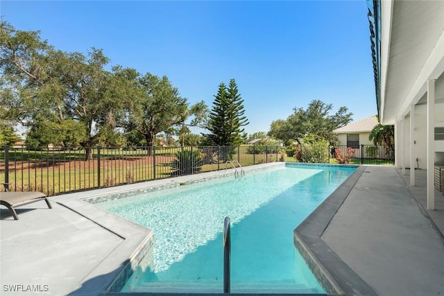 view of swimming pool featuring fence, a patio, and a fenced in pool