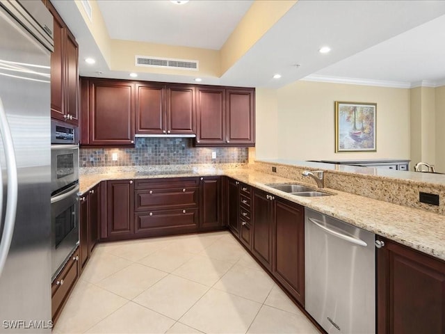 1050 Borghese Ln Unit 1804, Naples, FL 34114 - kitchen with light stone countertops, light tile patterned flooring, visible vents, a sink, and appliances with stainless steel finishes
