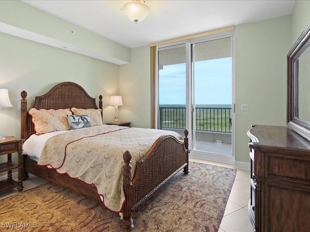 1050 Borghese Ln Unit 1804, Naples, FL 34114 - bedroom with light tile patterned flooring and access to outside