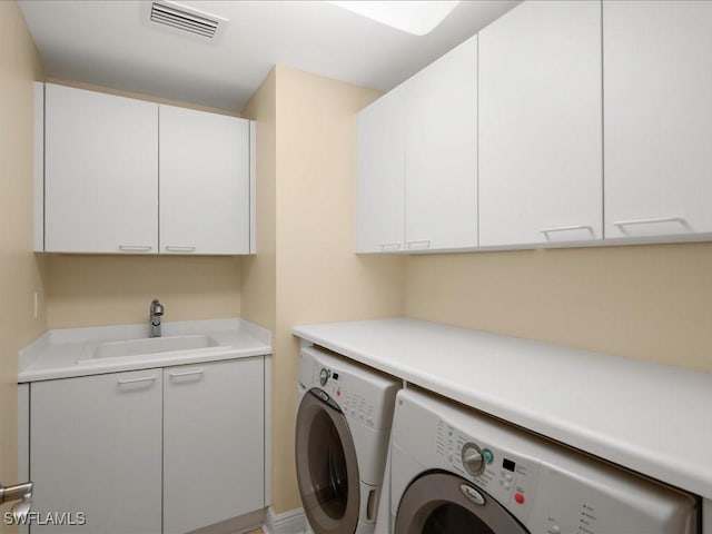 1050 Borghese Ln Unit 1804, Naples, FL 34114 - laundry room with cabinet space, visible vents, washer and dryer, and a sink