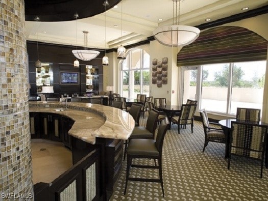1050 Borghese Ln Unit 1804, Naples, FL 34114 - bar featuring decorative light fixtures