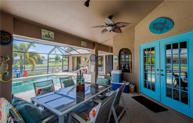 2128 SW 28th Ln, Cape Coral, FL 33914 - view of patio / terrace with a ceiling fan, an outdoor pool, outdoor dining space, and french doors