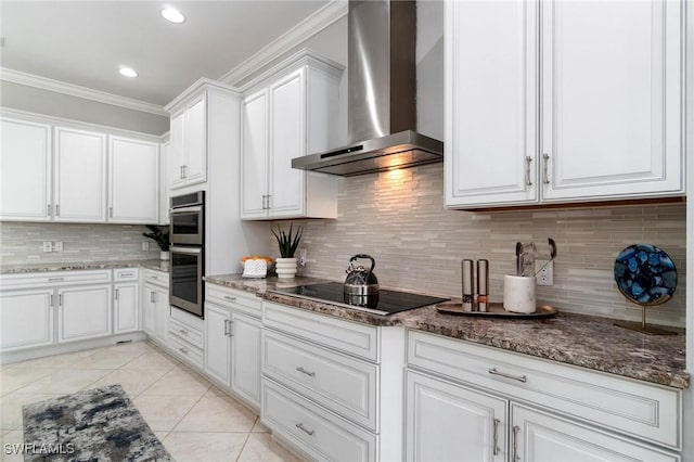 4437 Tamarind Way, Naples, FL 34119 - kitchen featuring wall chimney exhaust hood, black electric cooktop, stainless steel double oven, white cabinets, and ornamental molding