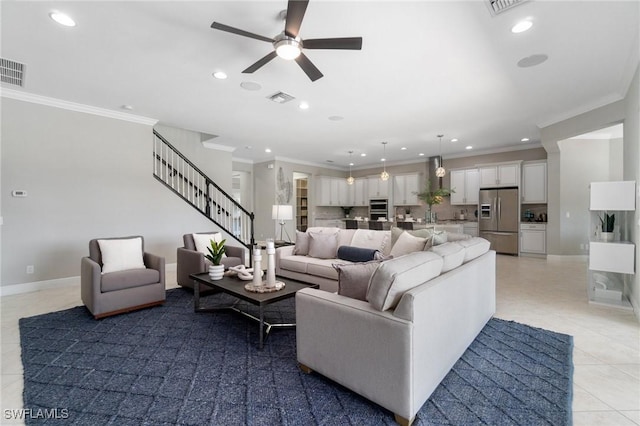 4437 Tamarind Way, Naples, FL 34119 - living area featuring a ceiling fan, light tile patterned floors, crown molding, recessed lighting, and stairs