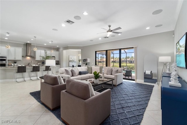 4437 Tamarind Way, Naples, FL 34119 - living room featuring light tile patterned flooring, recessed lighting, ceiling fan, and crown molding