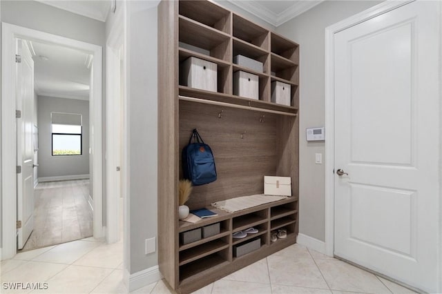 4437 Tamarind Way, Naples, FL 34119 - mudroom with crown molding, tile patterned flooring, and baseboards