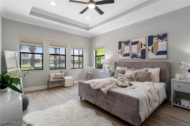 4437 Tamarind Way, Naples, FL 34119 - bedroom featuring crown molding, a raised ceiling, wood finished floors, baseboards, and recessed lighting