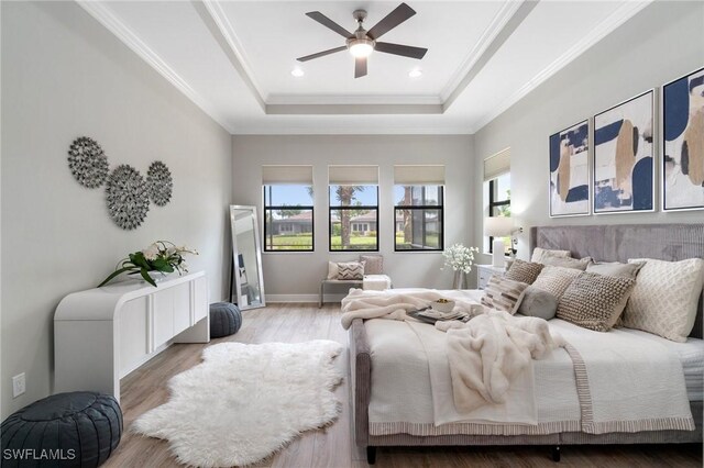 4437 Tamarind Way, Naples, FL 34119 - bedroom with a raised ceiling, wood finished floors, crown molding, ceiling fan, and recessed lighting