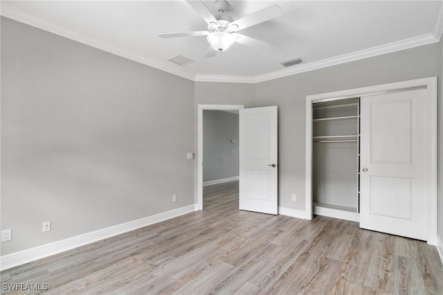 4437 Tamarind Way, Naples, FL 34119 - unfurnished bedroom with light wood-style flooring, a closet, crown molding, baseboards, and a ceiling fan