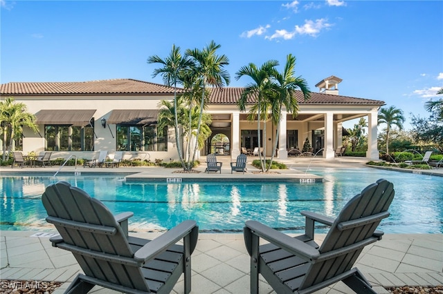 4437 Tamarind Way, Naples, FL 34119 - community pool with a patio area