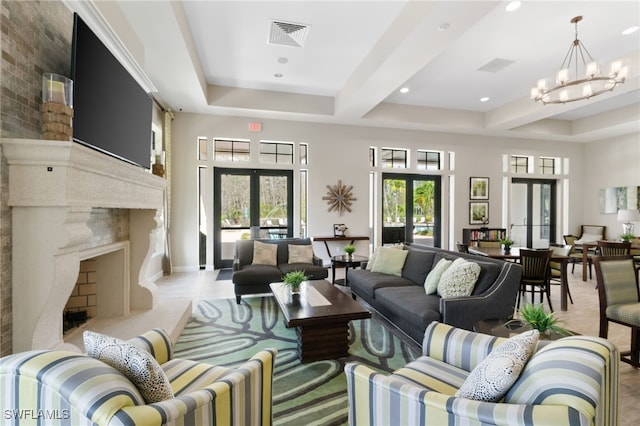 4437 Tamarind Way, Naples, FL 34119 - living room featuring french doors, healthy amount of natural light, a chandelier, a high end fireplace, and recessed lighting