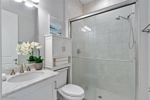 4437 Tamarind Way, Naples, FL 34119 - full bathroom featuring a shower stall, vanity, and toilet