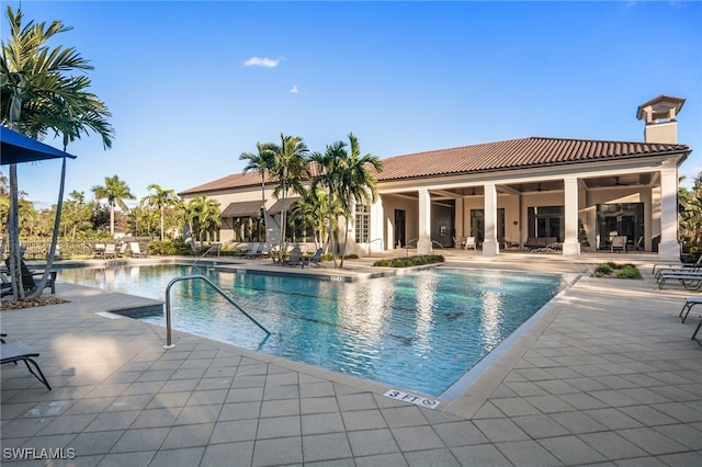 4437 Tamarind Way, Naples, FL 34119 - community pool featuring a patio area and ceiling fan