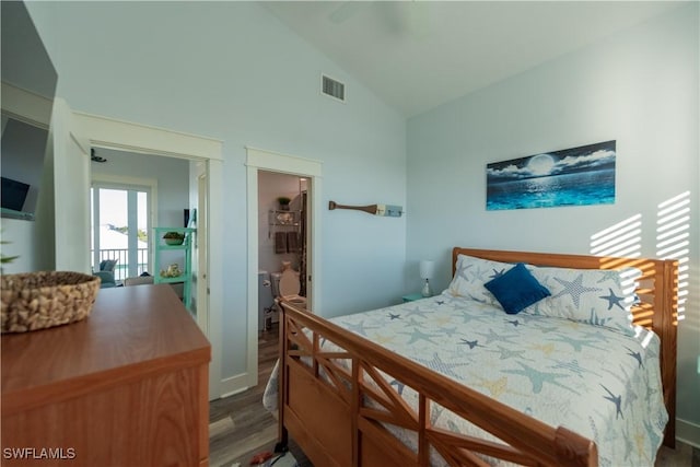 bedroom featuring wood finished floors and high vaulted ceiling