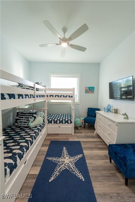 bedroom with wood finished floors and a ceiling fan
