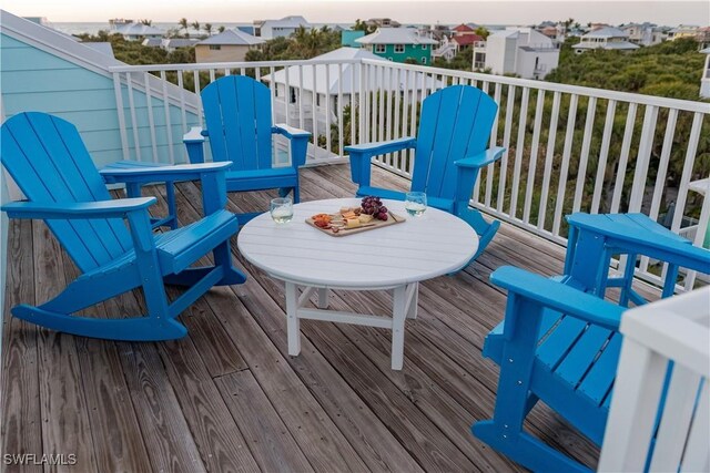 wooden terrace with a residential view