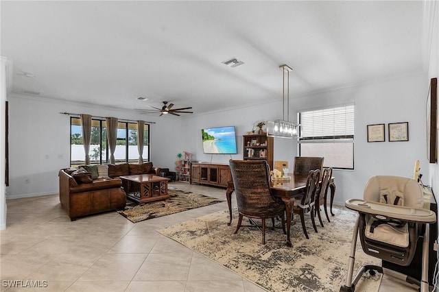 14634 Cantabria Dr, Fort Myers, FL 33905 - dining space with a ceiling fan, light tile patterned floors, baseboards, visible vents, and crown molding