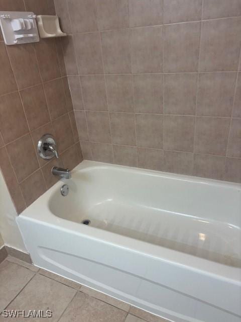 8326 Bernwood Cove Loop Unit 901, Fort Myers, FL 33966 - bathroom with tile patterned flooring and shower / bathtub combination