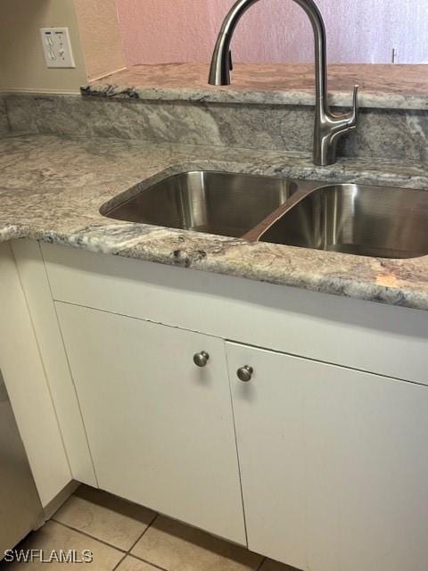 8326 Bernwood Cove Loop Unit 901, Fort Myers, FL 33966 - kitchen view of white cabinetry and light stone counters