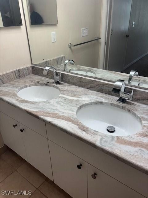 8326 Bernwood Cove Loop Unit 901, Fort Myers, FL 33966 - full bathroom featuring double vanity and tile patterned flooring