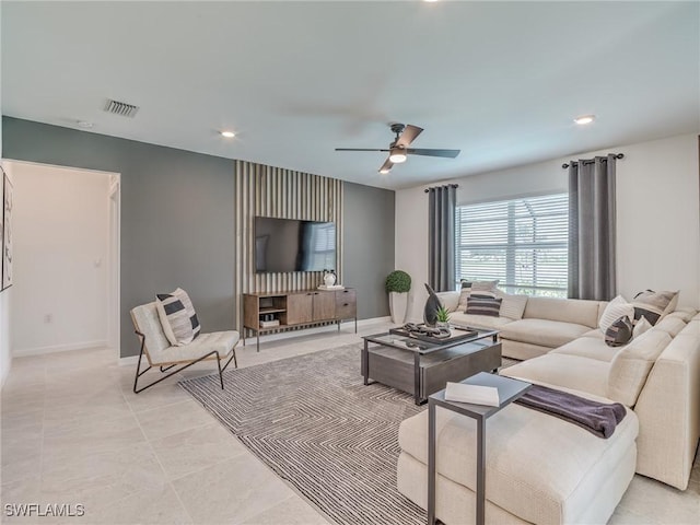 living room featuring baseboards, ceiling fan, recessed lighting, and visible vents