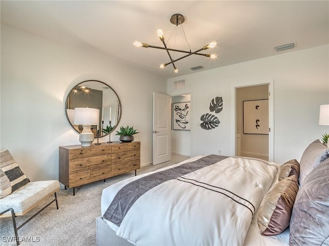 carpeted bedroom featuring a notable chandelier and visible vents