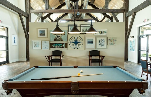 rec room featuring billiards, wood finished floors, baseboards, and high vaulted ceiling