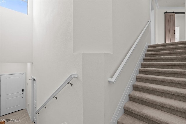 11792 Grand Belvedere Way Unit 202, Fort Myers, FL 33913 - staircase with a barn door