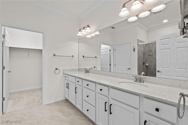 11792 Grand Belvedere Way Unit 202, Fort Myers, FL 33913 - bathroom with a shower stall, ornamental molding, double vanity, a spacious closet, and baseboards