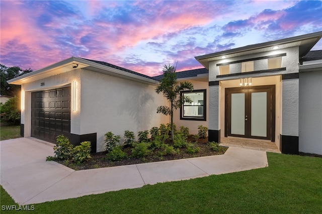 property exterior at dusk with stucco siding