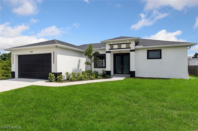 prairie-style home featuring a front lawn, an attached garage, stucco siding, and french doors