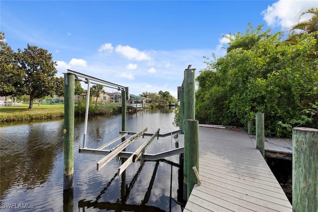 15461 River Cove Ct, North Fort Myers, FL 33917 - view of dock with boat lift and a water view