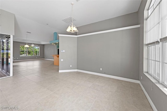 15461 River Cove Ct, North Fort Myers, FL 33917 - empty room with light tile patterned floors, baseboards, an inviting chandelier, and lofted ceiling