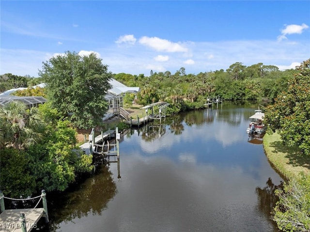 15461 River Cove Ct, North Fort Myers, FL 33917 - water view featuring boat lift and a dock