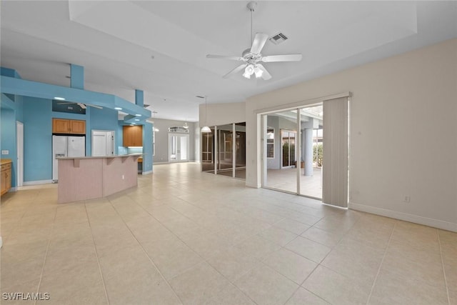 15461 River Cove Ct, North Fort Myers, FL 33917 - unfurnished living room featuring light tile patterned floors, baseboards, visible vents, and a ceiling fan
