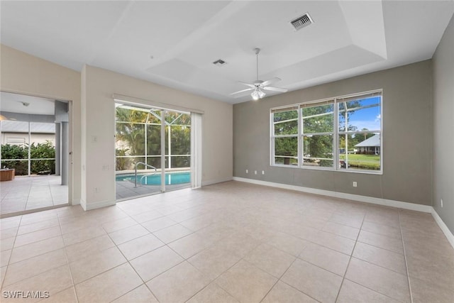 15461 River Cove Ct, North Fort Myers, FL 33917 - unfurnished room with a healthy amount of sunlight, ceiling fan, light tile patterned floors, and visible vents