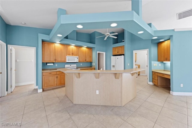 15461 River Cove Ct, North Fort Myers, FL 33917 - kitchen featuring white appliances, light tile patterned flooring, a towering ceiling, a ceiling fan, and baseboards