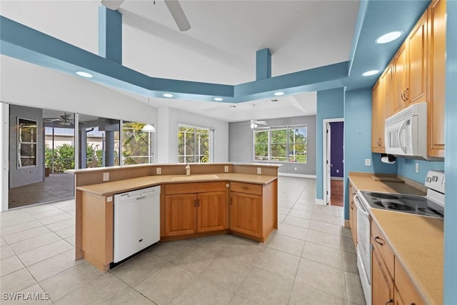 15461 River Cove Ct, North Fort Myers, FL 33917 - kitchen with light tile patterned floors, a sink, ceiling fan, white appliances, and light countertops