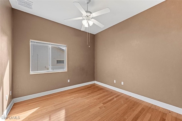 15461 River Cove Ct, North Fort Myers, FL 33917 - spare room with light wood finished floors, visible vents, and baseboards