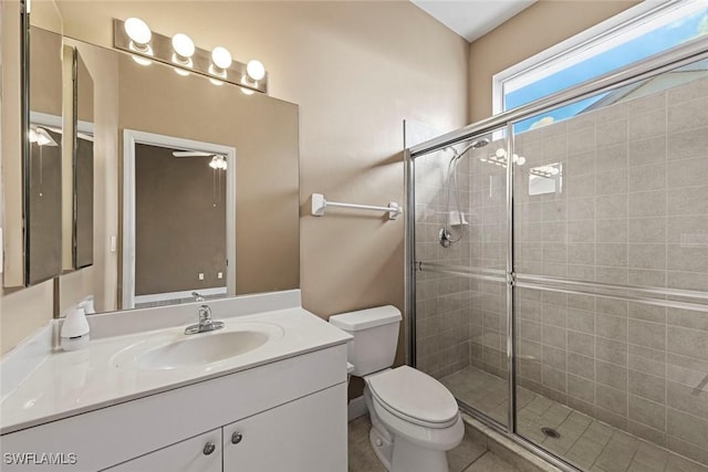 15461 River Cove Ct, North Fort Myers, FL 33917 - bathroom with a shower stall, vanity, and toilet