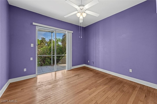 15461 River Cove Ct, North Fort Myers, FL 33917 - unfurnished room featuring baseboards, ceiling fan, and hardwood / wood-style flooring