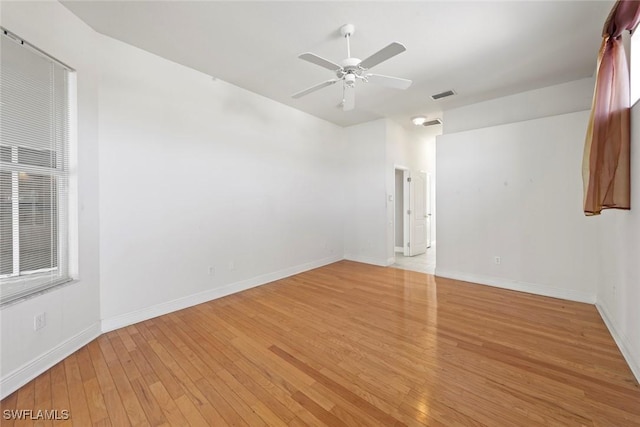 15461 River Cove Ct, North Fort Myers, FL 33917 - empty room featuring a ceiling fan, baseboards, light wood finished floors, and visible vents
