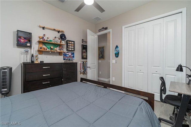 bedroom with a closet, visible vents, wood finished floors, and a ceiling fan