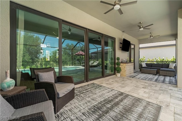 view of patio featuring outdoor lounge area, an outdoor pool, and ceiling fan