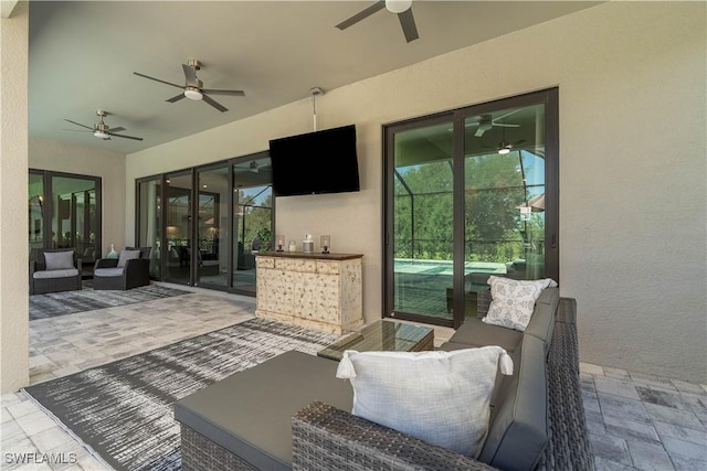 view of patio / terrace featuring outdoor lounge area, french doors, and a ceiling fan